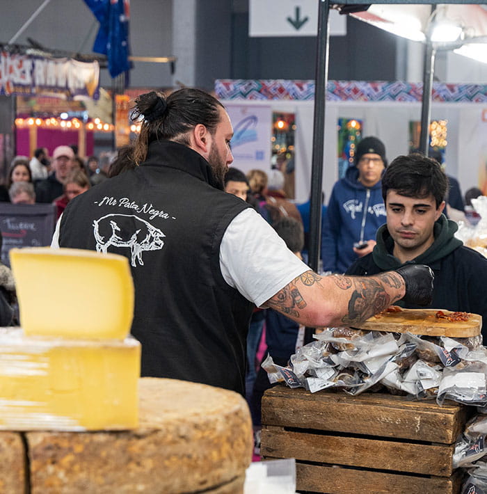 Exhibitor on a cheese and charcuterie stall